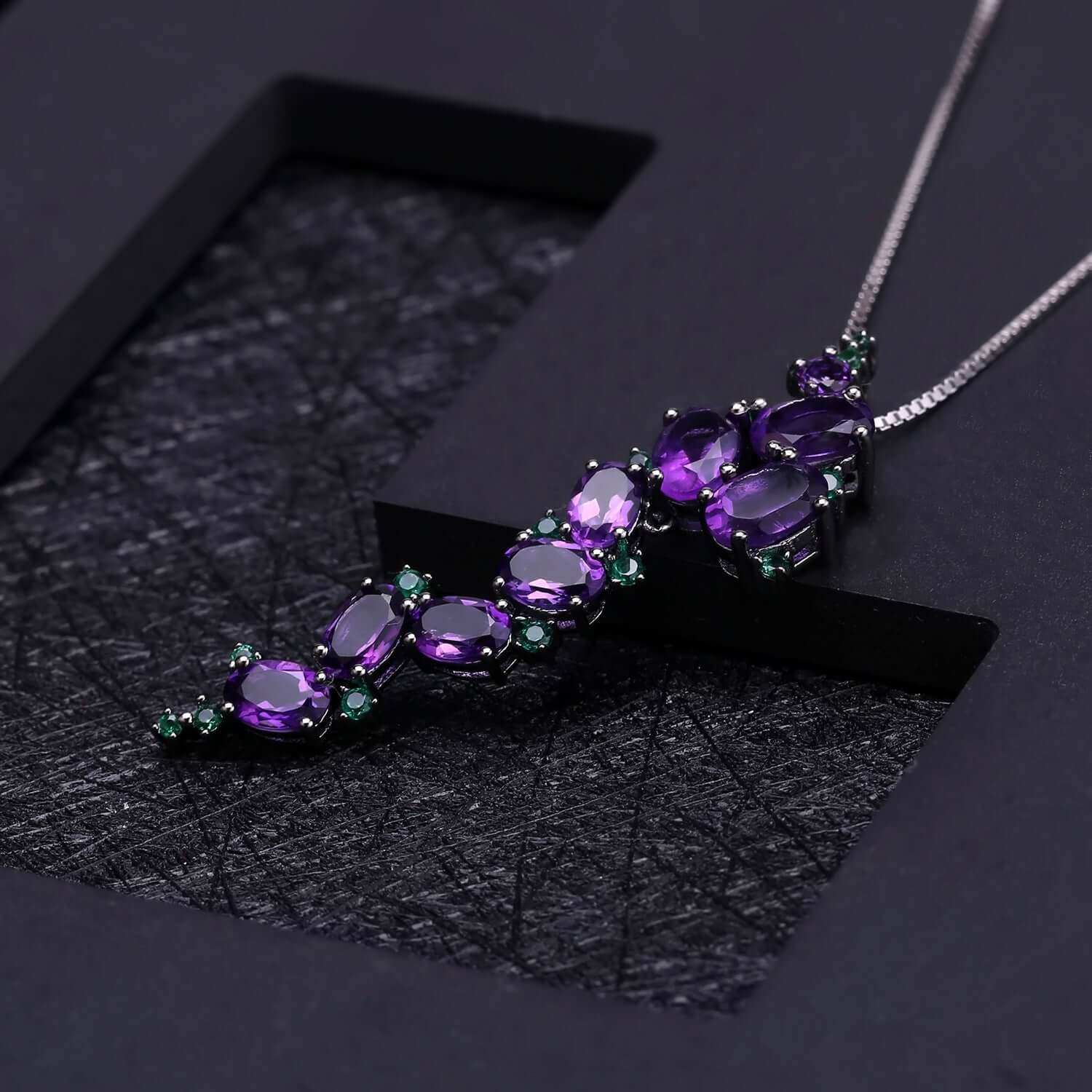 Luxury artisan-crafted jewelry featuring bold amethyst stone inlay