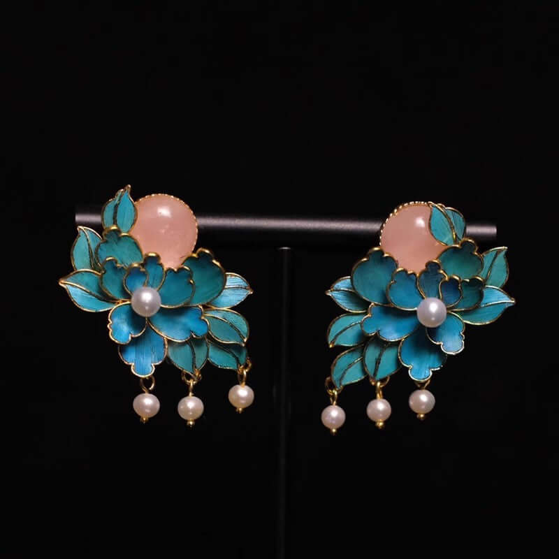 Delicate artisan pearl earrings featuring peony flower design
