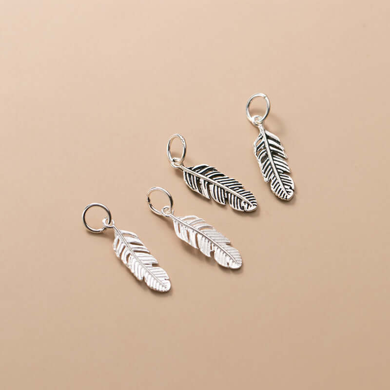 "Small feather pendant handmade DIY jewelry accessory"