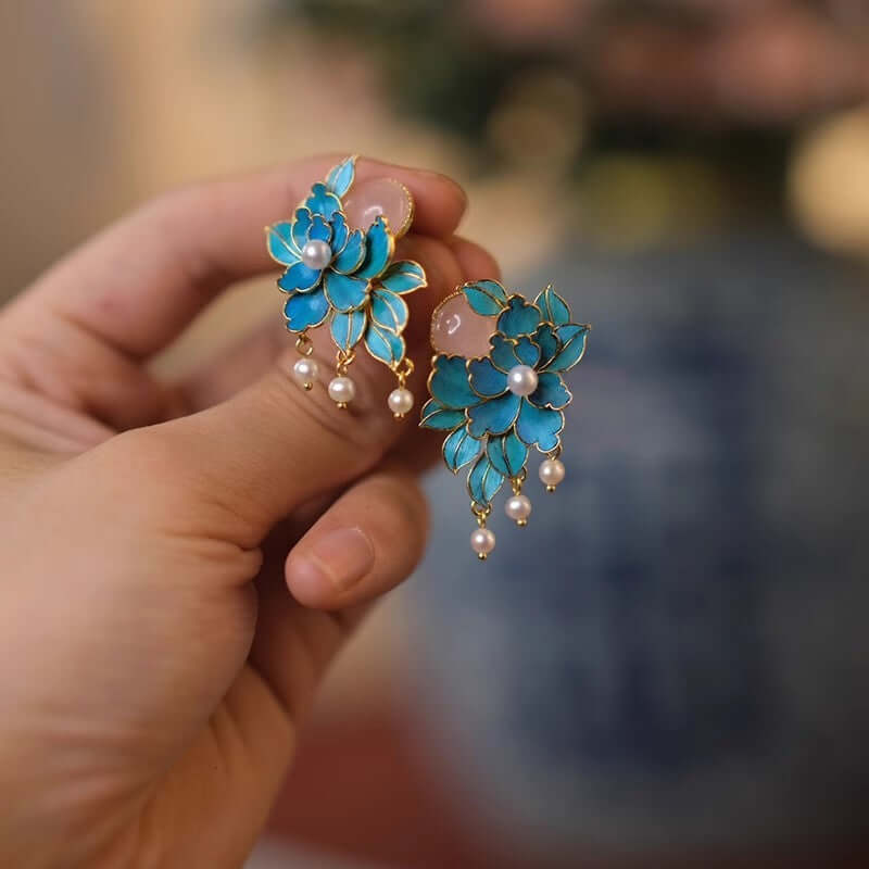 Artisan pearl earrings featuring delicate peony design