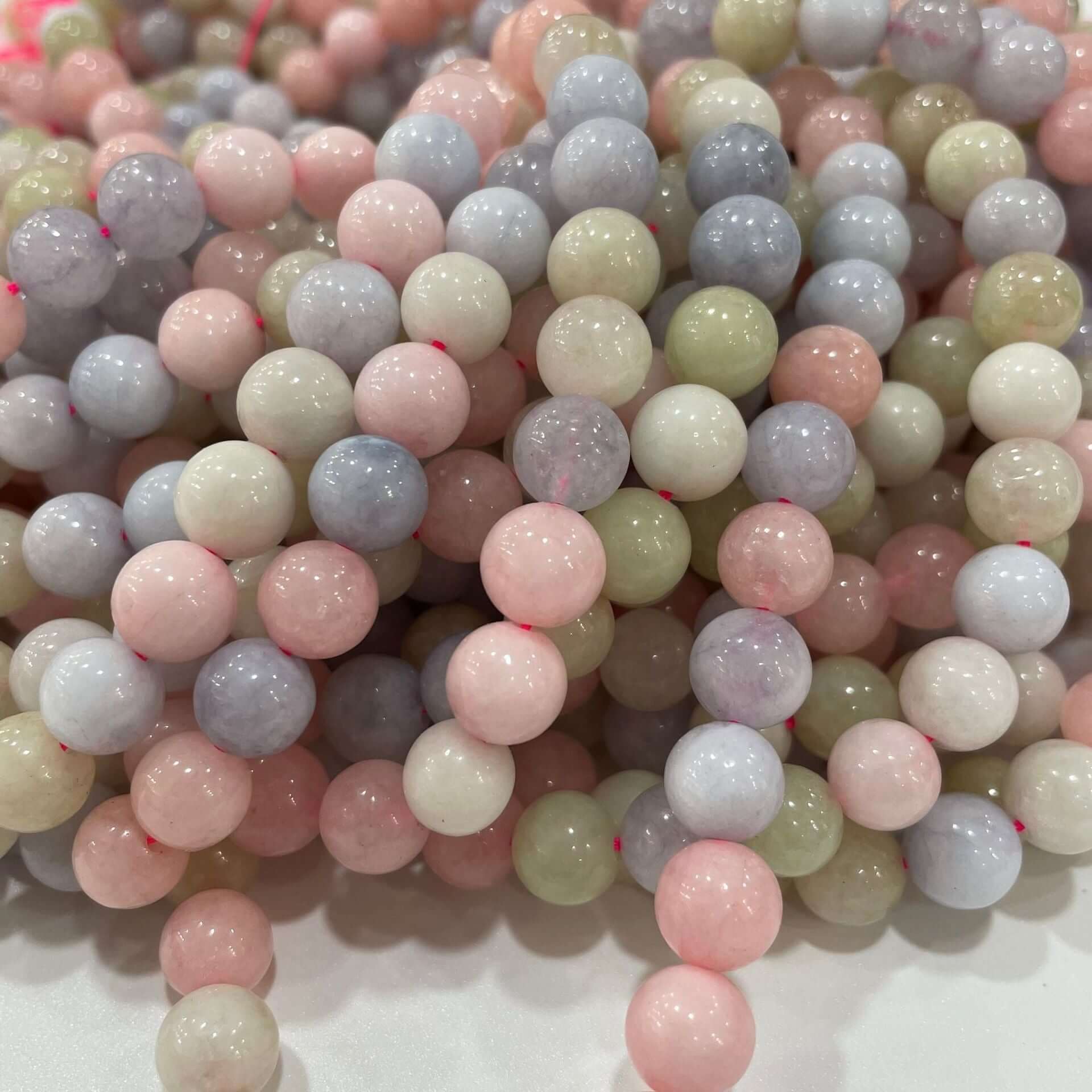Loose morganite beads in pastel colors for DIY handmade jewelry, showcasing natural stone in 6mm, 8mm, and 10mm sizes.